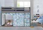 A gray loft bed with a blue and white patterned play curtain in a bright children's bedroom. A young boy is sitting on the floor inside the play area under the bed, reading a book. 23-Bed Tent - Curtain Set for Twin Loft or Bunk Bed (Bed Sold Separately)
