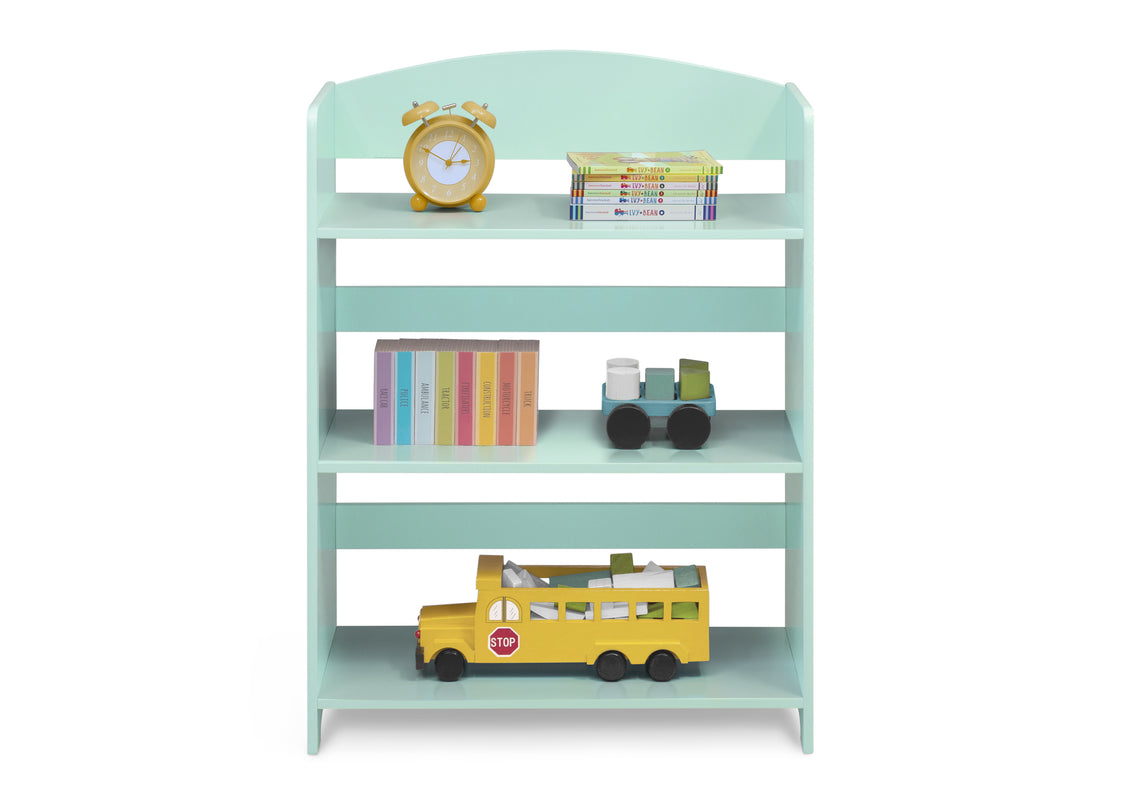 A mint green wooden 4-tier toy bookshelf styled with children's items including a yellow alarm clock, books, a toy train, and a yellow school bus, shown against a plain white background.