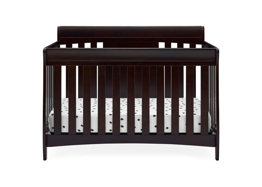 Dark wood crib with white bedding on a white background 10-Richmond 6-in-1 Convertible Baby Crib