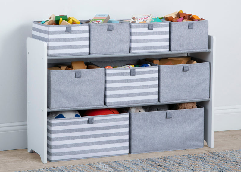 Storage unit with gray bins and colorful toys on a wooden floor. 5-GapKids Deluxe Toy Organizer