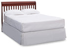 Bed with white mattress, wooden headboard, and pillows on a white background 65-Canton 4-in-1 Crib
