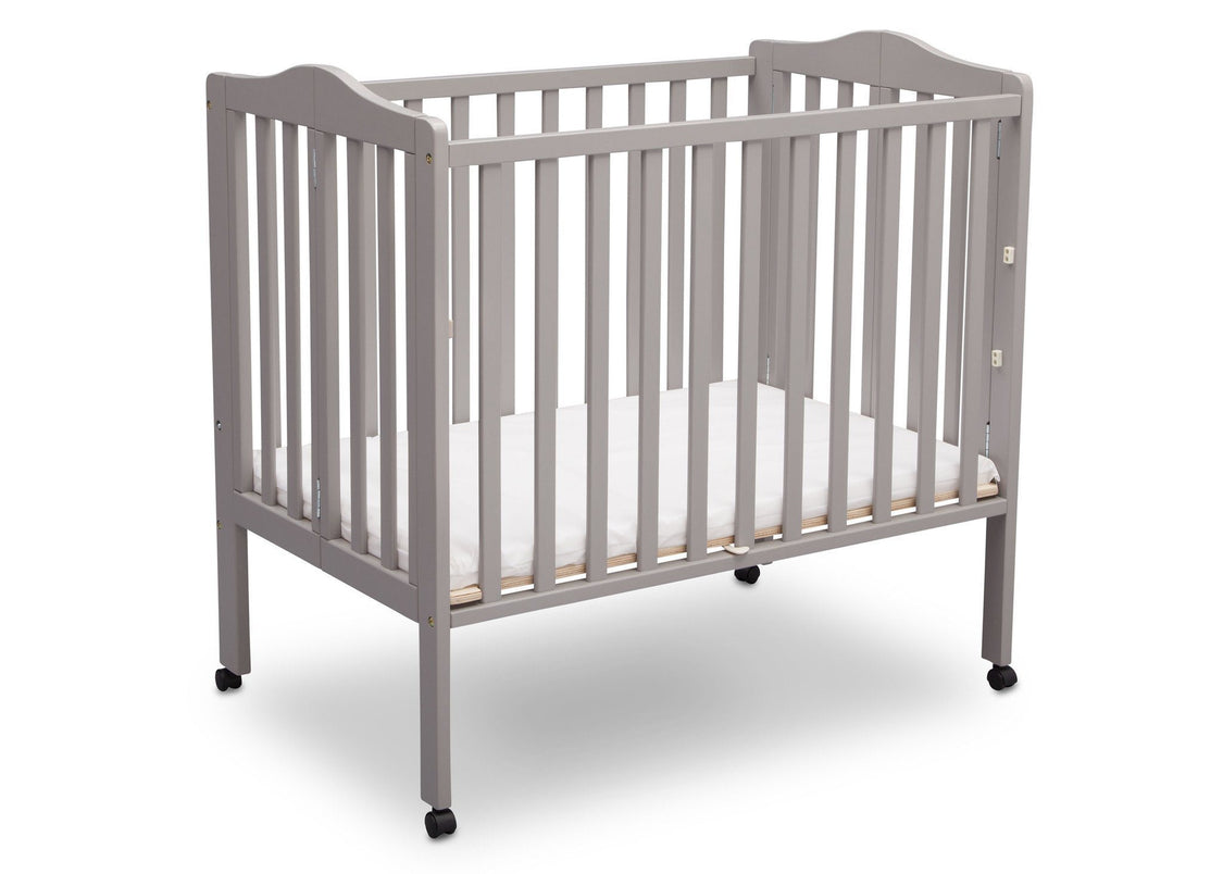 Delta Children Grey (180) Portable Folding Crib with Mattress, angled view b4b